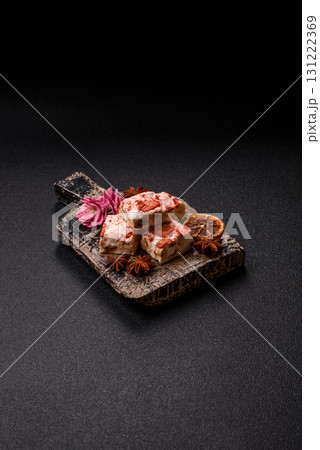 Nougat or white caramel with hazelnuts and strawberry pieces. White nougat 131222369