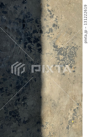 Grunge concrete wall texture with dark and light contrast 131222619