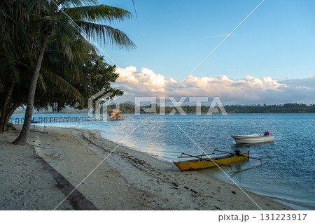 Sunset beach with boats at Bolilanga Island, Togian archipelago, Sulawesi, Indonesia Sunset beach with boats at Bolilanga Island, Togian archipelago, Sulawesi, Indonesia 131223917