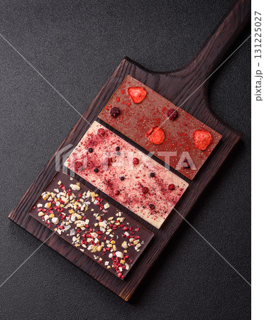 Bar sweet craft artisan chocolate with dried fruits made at home. Craft chocolate 131225027