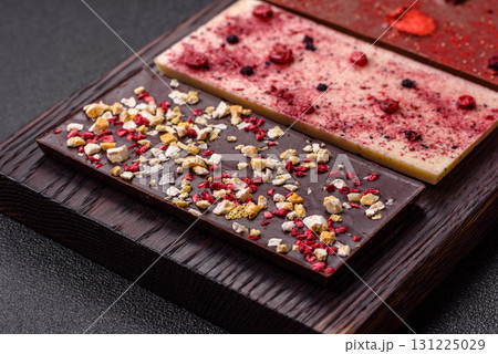 Bar sweet craft artisan chocolate with dried fruits made at home. Craft chocolate 131225029