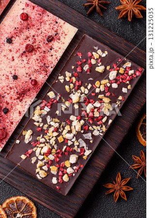 Bar sweet craft artisan chocolate with dried fruits made at home. Craft chocolate Bar sweet craft artisan chocolate with dried fruits made at home. Craft chocolate 131225035
