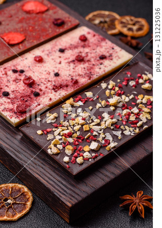 Bar sweet craft artisan chocolate with dried fruits made at home. Craft chocolate Bar sweet craft artisan chocolate with dried fruits made at home. Craft chocolate 131225036