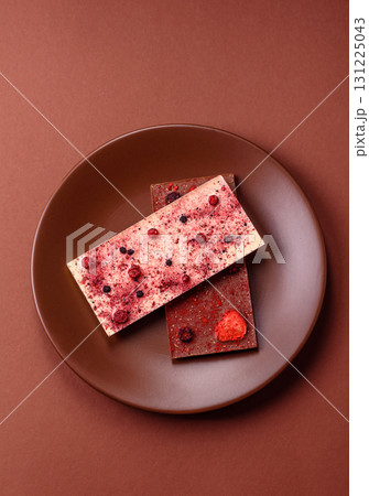 Bar sweet craft artisan chocolate with dried fruits made at home. Craft chocolate 131225043