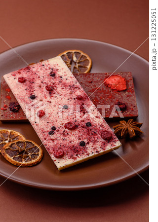 Bar sweet craft artisan chocolate with dried fruits made at home. Craft chocolate 131225051