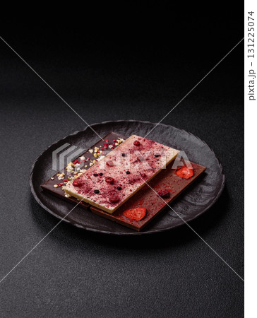 Bar sweet craft artisan chocolate with dried fruits made at home. Craft chocolate 131225074