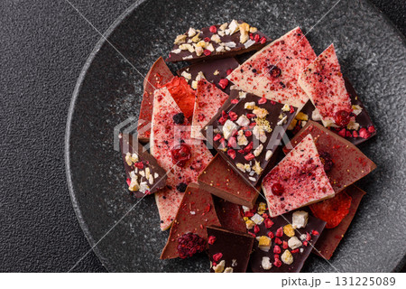 Bar sweet craft artisan chocolate with dried fruits made at home. Craft chocolate 131225089