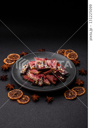 Bar sweet craft artisan chocolate with dried fruits made at home. Craft chocolate 131225099