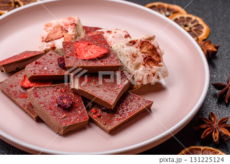 Bar sweet craft artisan chocolate with dried fruits made at home. Craft chocolate 131225124
