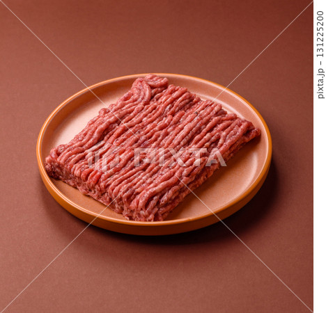Raw ground beef meat food, ingredient for making cutlets or meatballs. Raw ground beef 131225200