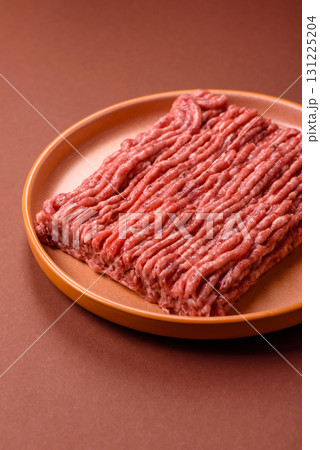 Raw ground beef meat food, ingredient for making cutlets or meatballs. Raw ground beef Raw ground beef meat food, ingredient for making cutlets or meatballs. Raw ground beef 131225204