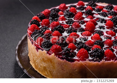 Pie, cheesecake with raspberries and blackberries, mascarpone cheese. Piece of cheesecake 131225269