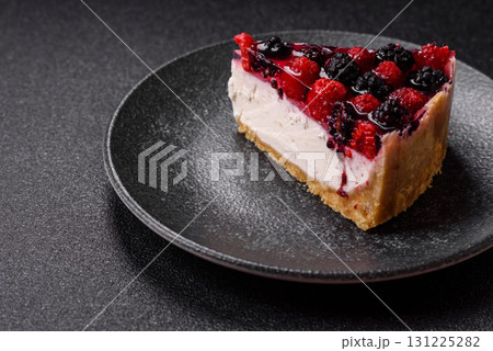 Pie, cheesecake with raspberries and blackberries, mascarpone cheese. Piece of cheesecake 131225282
