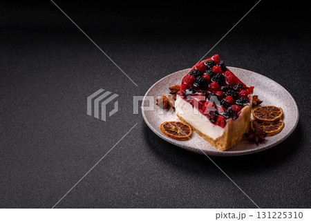 Pie, cheesecake with raspberries and blackberries, mascarpone cheese. Piece of cheesecake 131225310