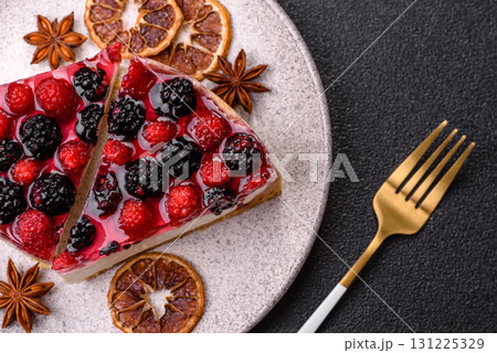 Pie, cheesecake with raspberries and blackberries, mascarpone cheese. Piece of cheesecake 131225329