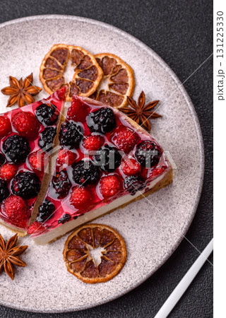 Pie, cheesecake with raspberries and blackberries, mascarpone cheese. Piece of cheesecake 131225330
