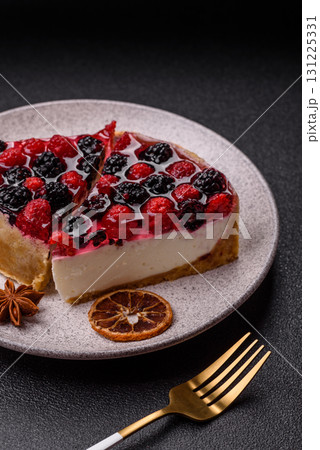 Pie, cheesecake with raspberries and blackberries, mascarpone cheese. Piece of cheesecake 131225331
