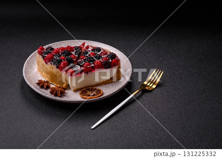 Pie, cheesecake with raspberries and blackberries, mascarpone cheese. Piece of cheesecake 131225332