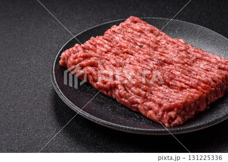 Raw ground beef meat food, ingredient for making cutlets or meatballs. Raw ground beef 131225336