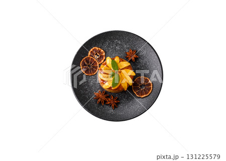 Sweet round pie or tart with apples and peach. Mini sweet tart 131225579