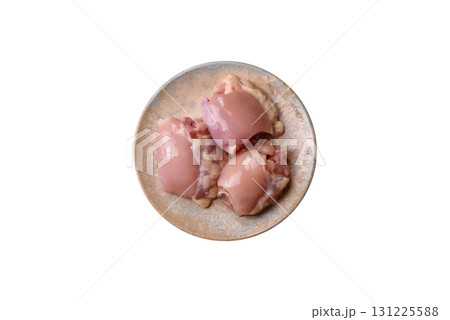Raw chicken thigh fillet without skin and bone with salt and spices. Raw chicken fillet for cooking 131225588