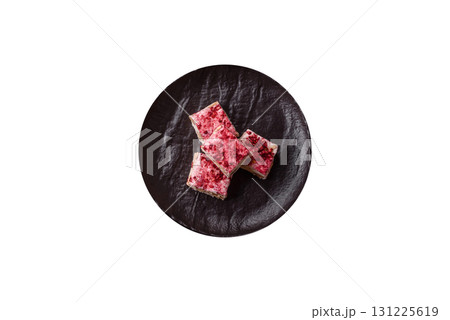 Nougat or white caramel with hazelnuts and strawberry pieces. White nougat Nougat or white caramel with hazelnuts and strawberry pieces. White nougat 131225619