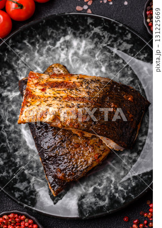 Food, seafood, grilled fish fillet with lemon, salt and spices. Grilled fish fillet Food, seafood, grilled fish fillet with lemon, salt and spices. Grilled fish fillet 131225669