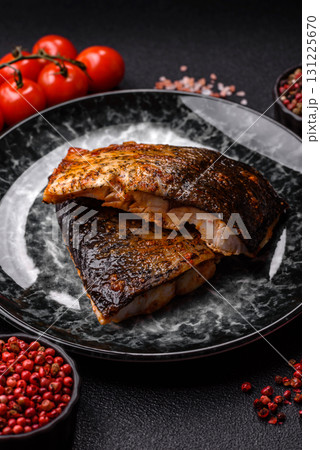 Food, seafood, grilled fish fillet with lemon, salt and spices. Grilled fish fillet Food, seafood, grilled fish fillet with lemon, salt and spices. Grilled fish fillet 131225670