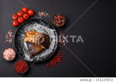 Food, seafood, grilled fish fillet with lemon, salt and spices. Grilled fish fillet Food, seafood, grilled fish fillet with lemon, salt and spices. Grilled fish fillet 131225672