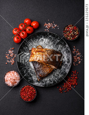 Food, seafood, grilled fish fillet with lemon, salt and spices. Grilled fish fillet Food, seafood, grilled fish fillet with lemon, salt and spices. Grilled fish fillet 131225673