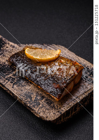 Food, seafood, grilled fish fillet with lemon, salt and spices. Grilled fish fillet Food, seafood, grilled fish fillet with lemon, salt and spices. Grilled fish fillet 131225718
