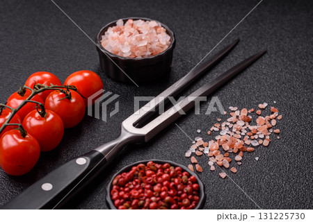 Empty meat or steak fork with vegetables, spices and other ingredients. Meat fork Empty meat or steak fork with vegetables, spices and other ingredients. Meat fork 131225730