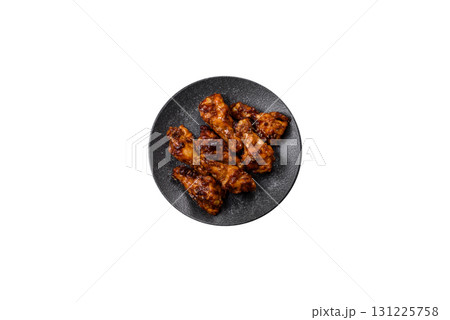 Grilled or barbecued chicken wings with teriyaki sauce, spices and sesame seeds. Teriyaki chicken 131225758