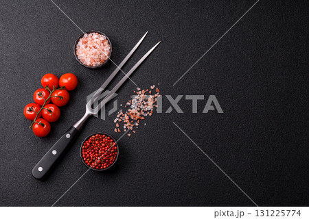 Empty meat or steak fork with vegetables, spices and other ingredients. Meat fork 131225774