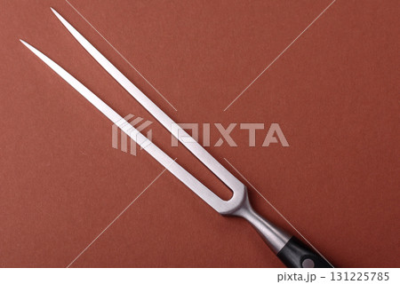 Empty meat or steak fork with vegetables, spices and other ingredients. Meat fork 131225785