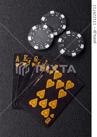 Playing card game poker in casino with chips, bets and risk. Cards and chips on elt Playing card game poker in casino with chips, bets and risk. Cards and chips on elt 131226711