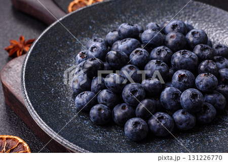 Fresh juicy blueberries, healthy vegan food with vitamins and minerals. Blueberries berry Fresh juicy blueberries, healthy vegan food with vitamins and minerals. Blueberries berry 131226770