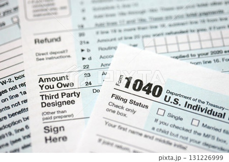 1040 US individual income tax return form blank close up. Few pages of united states tax blank 131226999