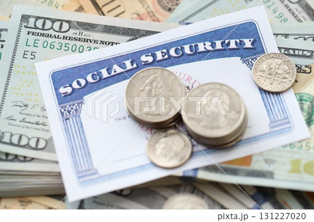 American US dollars money bills and US social security number card close up American US dollars money bills and US social security number card close up 131227020