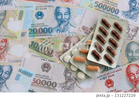 Vietnamese dong currency money bills and medicine pills. The concept of medicine and pharmacy 131227220