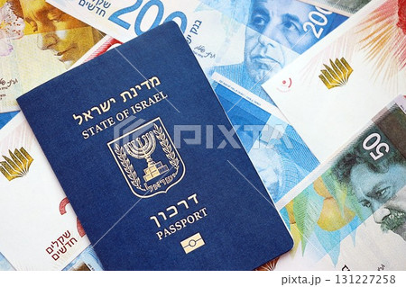 Israel New Shekels banknotes and passport. The current Israel money bills and biometrical pass Israel New Shekels banknotes and passport. The current Israel money bills and biometrical pass 131227258