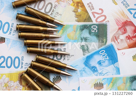 Israel New Shekels banknotes and bullets. The current Israel money bills and ammo Israel New Shekels banknotes and bullets. The current Israel money bills and ammo 131227260