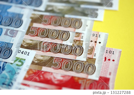 Pakistan rupees banknotes on yellow background. The current Pakistan money bills 131227288