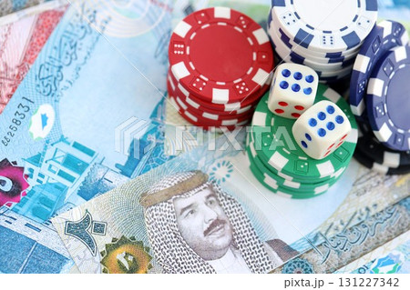 Bahraini dinar currency money bills and casino chips with dice. The concept of gambling and casino Bahraini dinar currency money bills and casino chips with dice. The concept of gambling and casino 131227342
