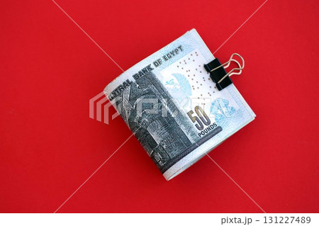 Egyptian pound money bills in big amount on red. Finance and banking concept 131227489