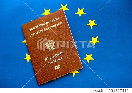 Austria passport on European union blue flag background. Citizenship in countries of Europe Austria passport on European union blue flag background. Citizenship in countries of Europe 131227513