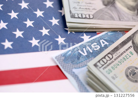 Work and Travel VISA, Immigration with Dollars banknotes on US flag Work and Travel VISA, Immigration with Dollars banknotes on US flag 131227556