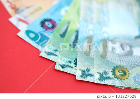 Bahraini dinar money bills in big amount on red. Finance and banking concept 131227629