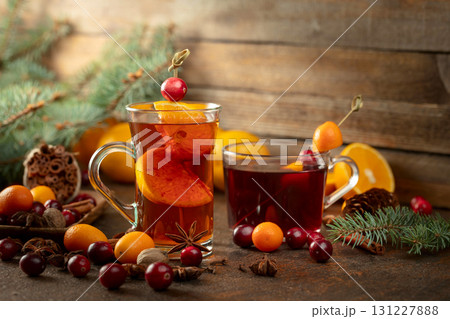 Winter drinks with ingredients on a old kitchen table. Winter drinks with ingredients on a old kitchen table. 131227888
