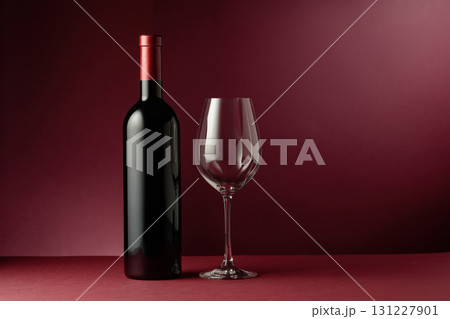 Red wine on a dark red background. 131227901